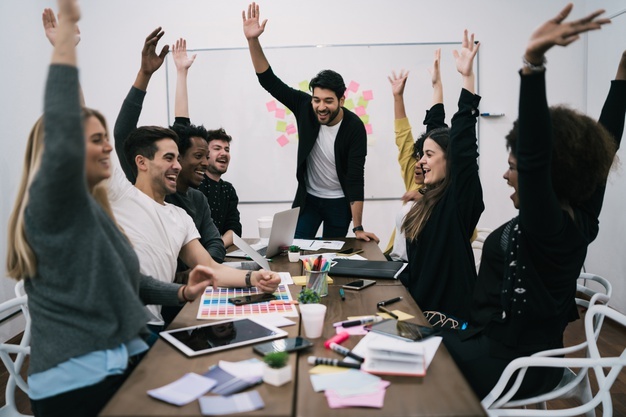 happy-business-team-celebrating-with-raised-up-hands-office-success-winning-concept