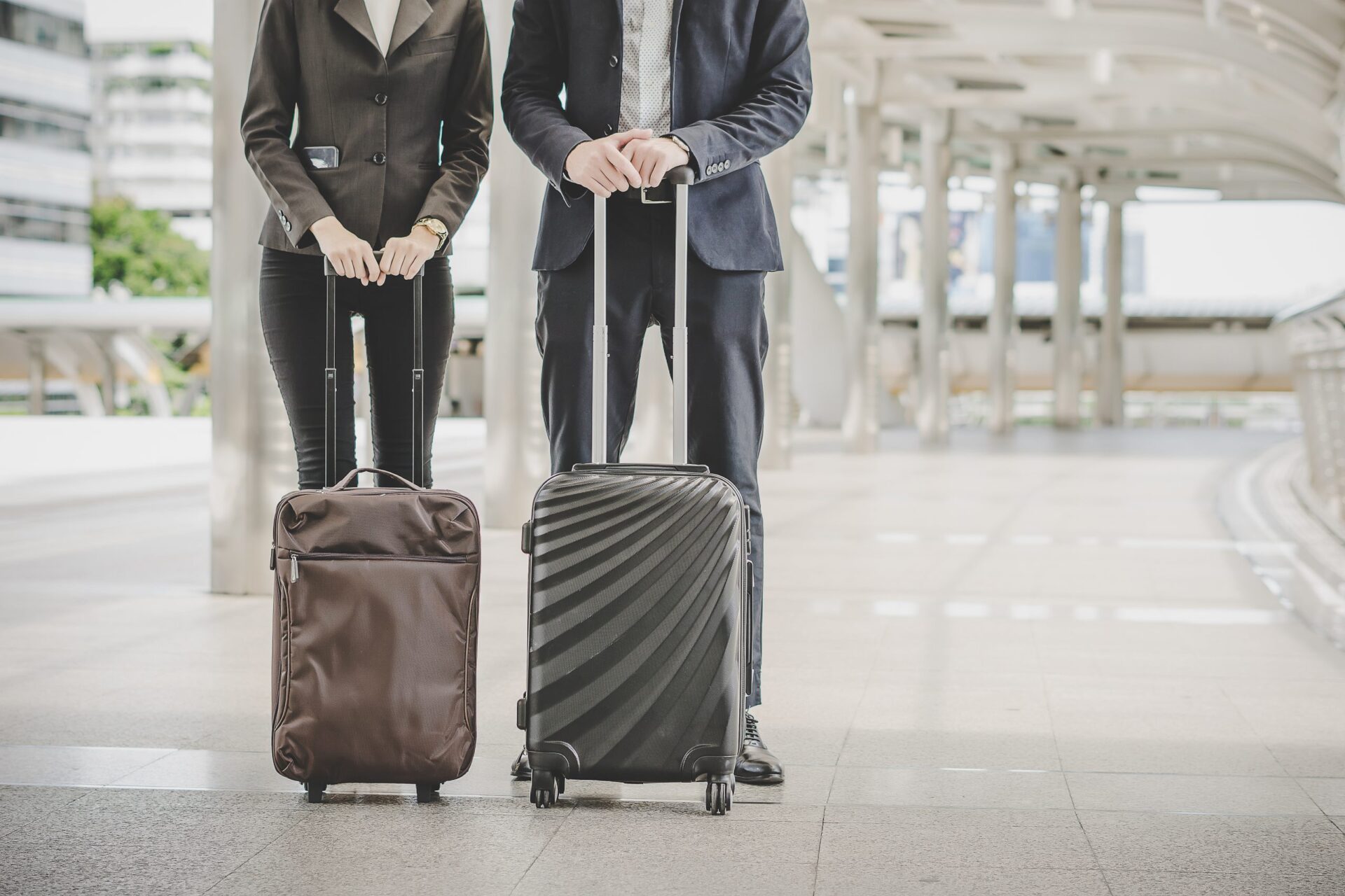 business-man-woman-are-going-business-trip with suite case for each one