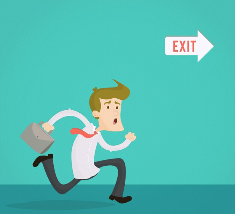 A picture of an employee running towards an exit sign, capturing a sense of urgency or the end of a workday.