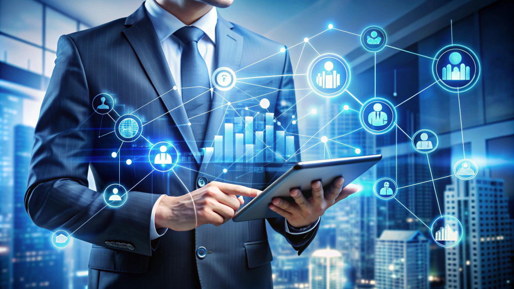 The image depicts a business professional using a tablet in a modern office setting, with a futuristic digital interface overlay. The interface showcases interconnected icons representing people, graphs, and data, illustrating concepts like employee management, data analytics, and network connectivity. The vibrant blue hues and glowing effects emphasize technology and efficiency, highlighting the integration of digital tools in business operations.